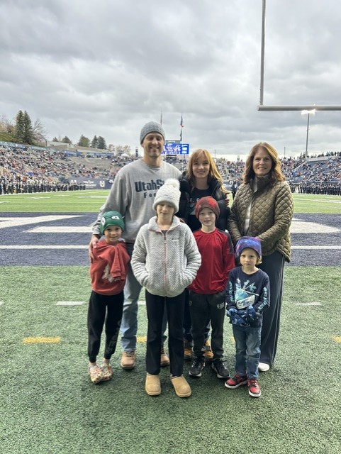 Family at USU football game Chase Harris